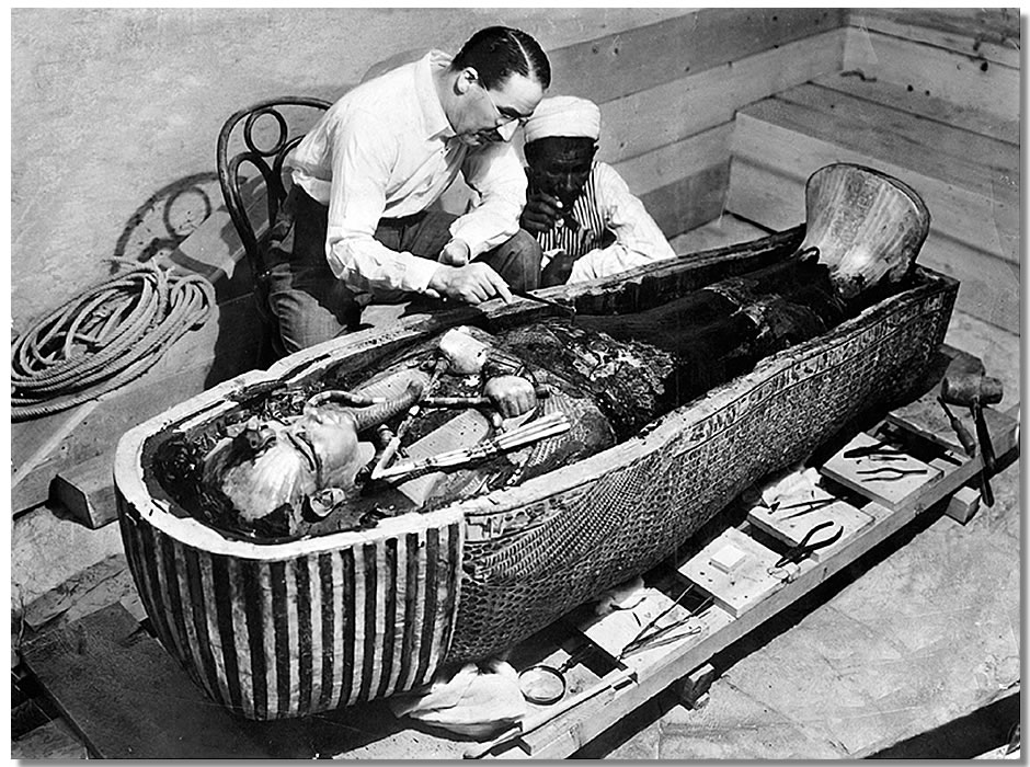 Howard Carter examining Tutankhamun's sarcophagus, 1923