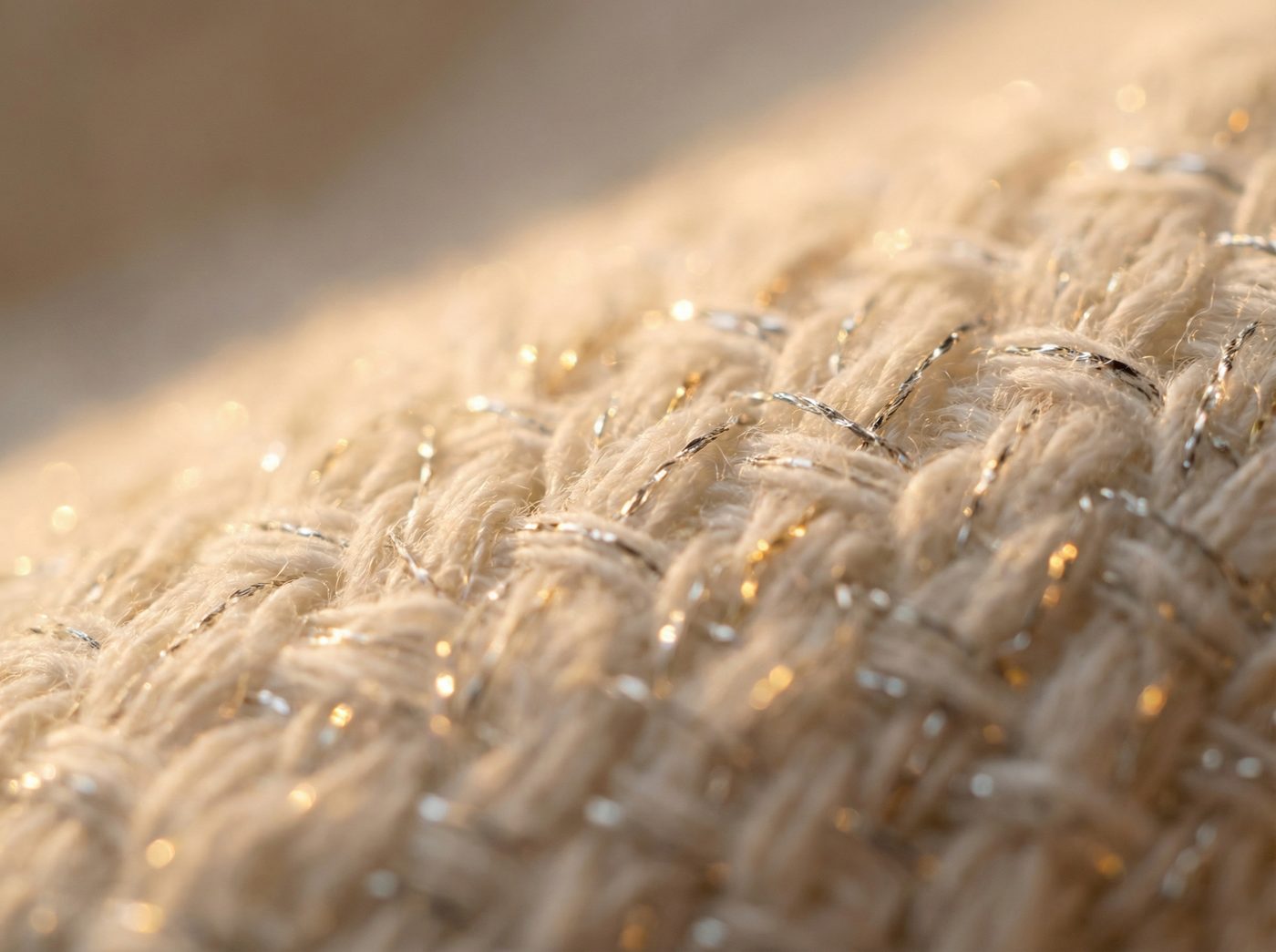 Macro close-up of silver threads woven into organic cotton