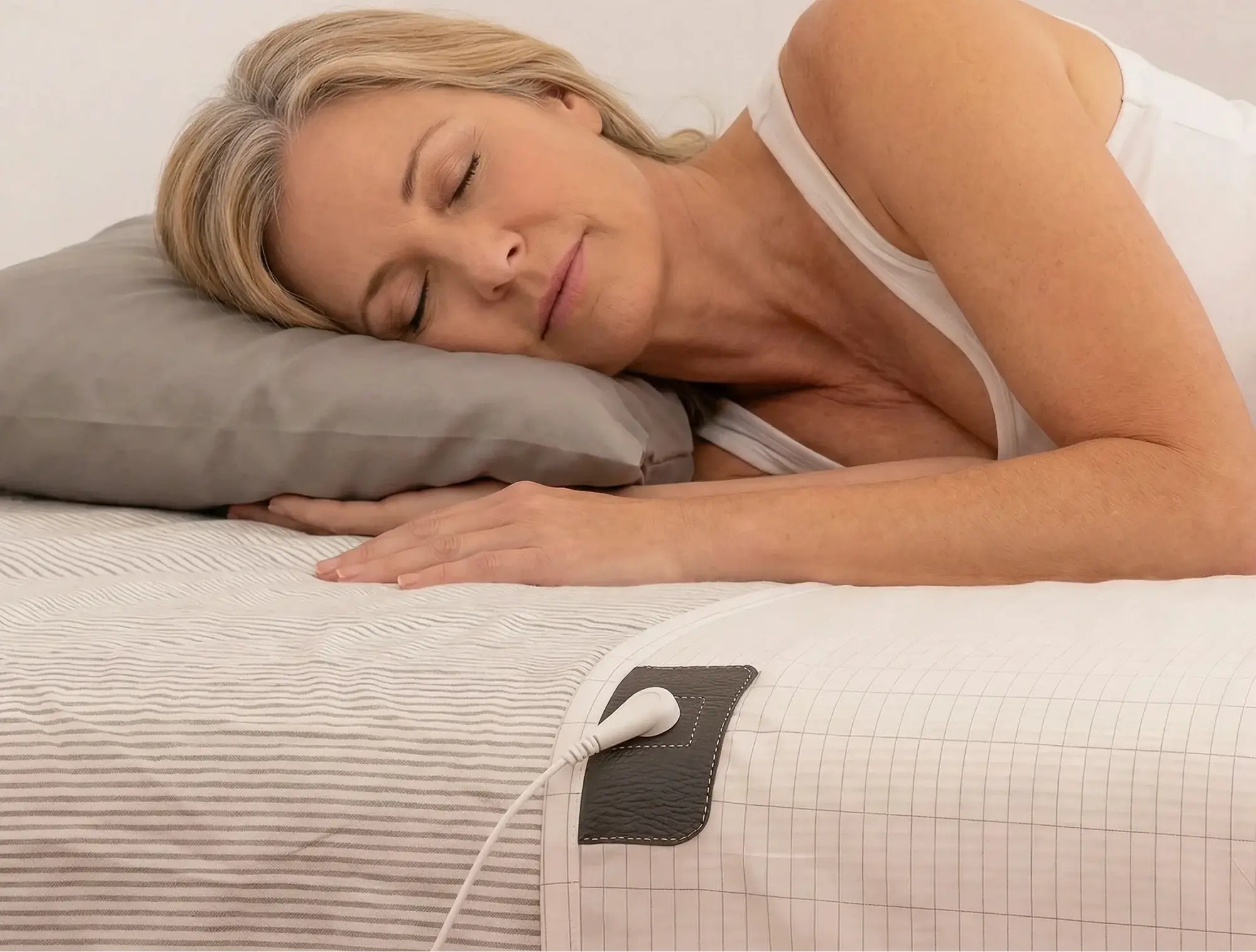 Woman sleeping on the Terra grounding sheet